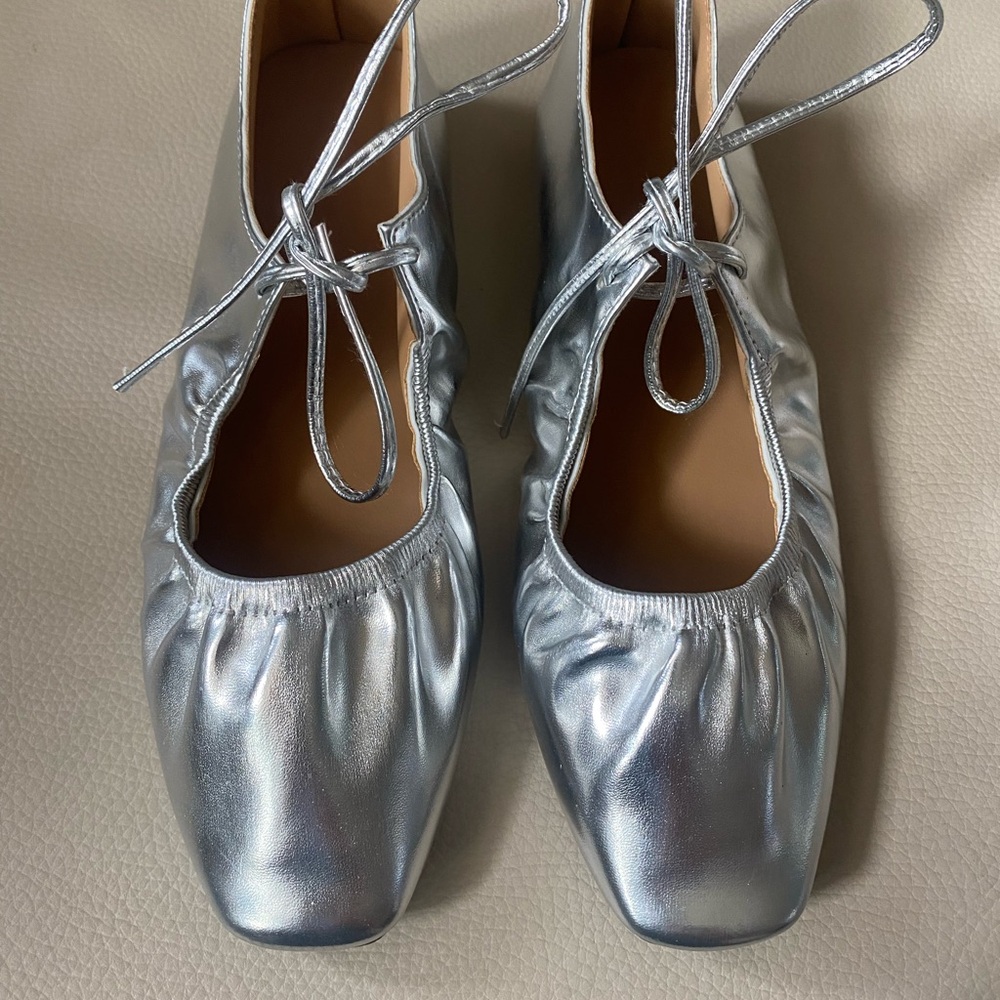 Silver ballet style flats size 6. Worn once. Like new. Thin tie at instep